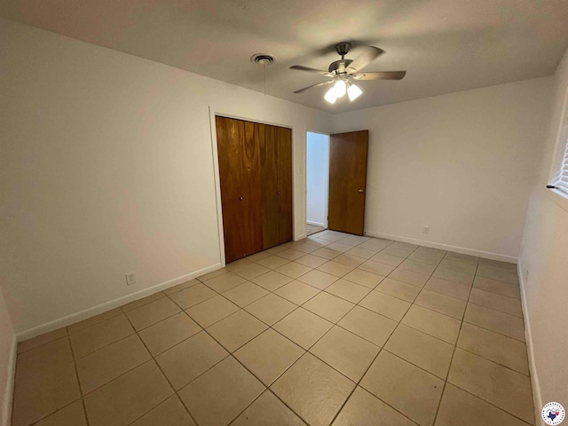3123 Hickory St, Texarkana, AR 71854 - unfurnished bedroom with light tile patterned flooring, a closet, and ceiling fan