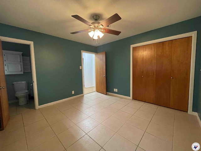 3123 Hickory St, Texarkana, AR 71854 - unfurnished bedroom featuring light tile patterned floors, a closet, a ceiling fan, and ensuite bath