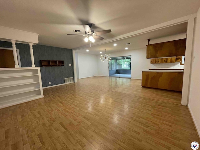 3123 Hickory St, Texarkana, AR 71854 - unfurnished living room featuring ceiling fan, a chandelier, light wood-type flooring, recessed lighting, and an accent wall