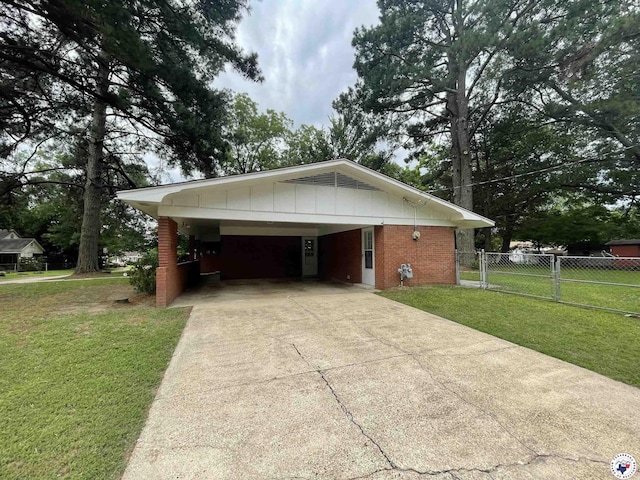 3123 Hickory St, Texarkana, AR 71854 - view of home's exterior featuring driveway, brick siding, and a carport