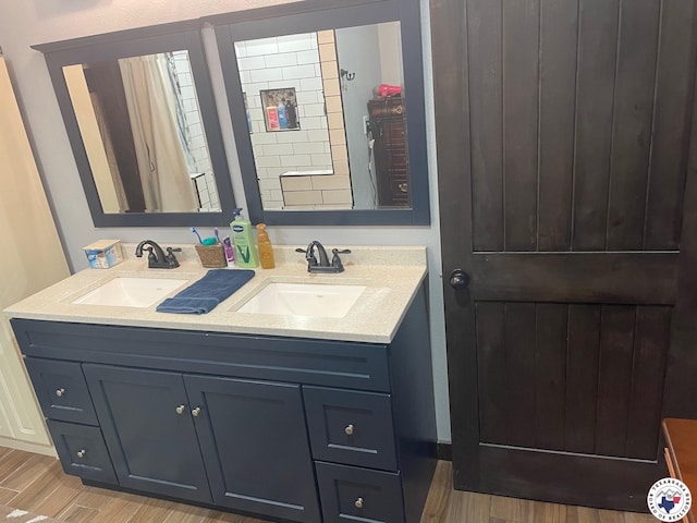 24075 US Highway 59 N, Queen City, TX 75551 - bathroom with double vanity and wood finished floors
