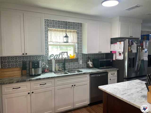 24075 US Highway 59 N, Queen City, TX 75551 - kitchen featuring appliances with stainless steel finishes, a sink, white cabinets, and tasteful backsplash