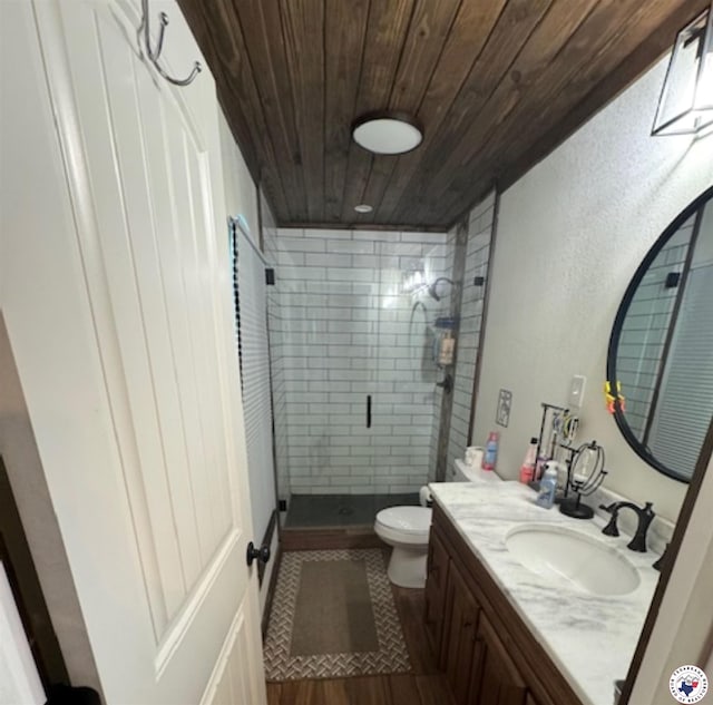 24075 US Highway 59 N, Queen City, TX 75551 - full bath featuring wooden ceiling, a stall shower, vanity, toilet, and wood finished floors