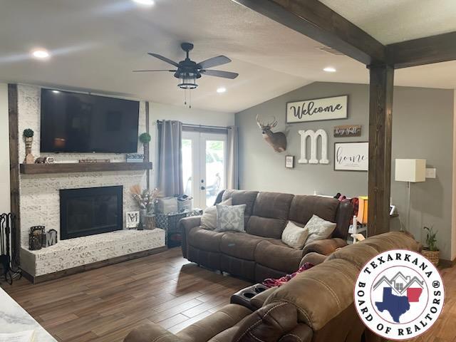 24075 US Highway 59 N, Queen City, TX 75551 - living area featuring a ceiling fan, wood finished floors, vaulted ceiling, french doors, and recessed lighting