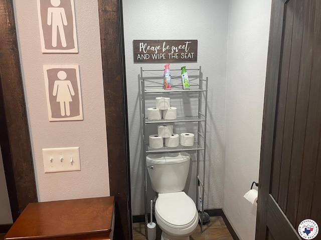 24075 US Highway 59 N, Queen City, TX 75551 - bathroom with toilet, baseboards, and a textured wall
