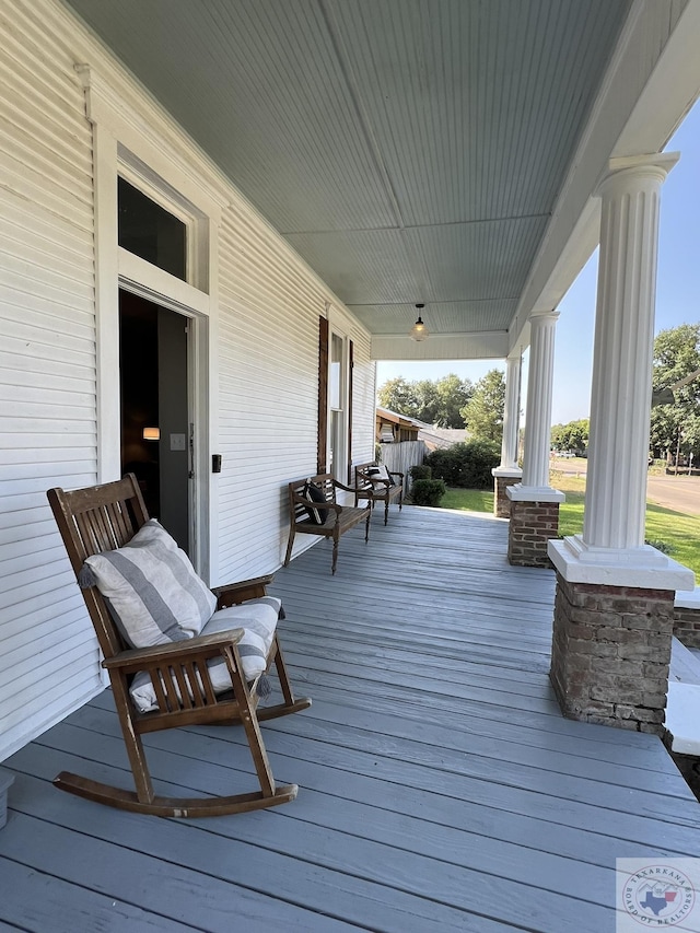 wooden deck featuring a porch