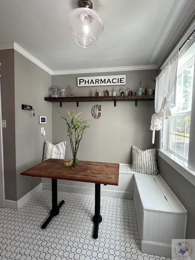 interior space featuring crown molding and light tile patterned flooring