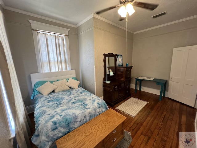 bedroom with crown molding, dark wood-type flooring, and ceiling fan