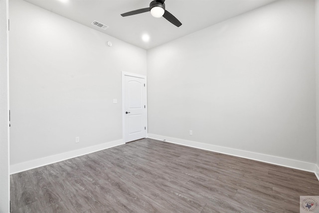 spare room featuring baseboards, visible vents, dark wood finished floors, ceiling fan, and recessed lighting