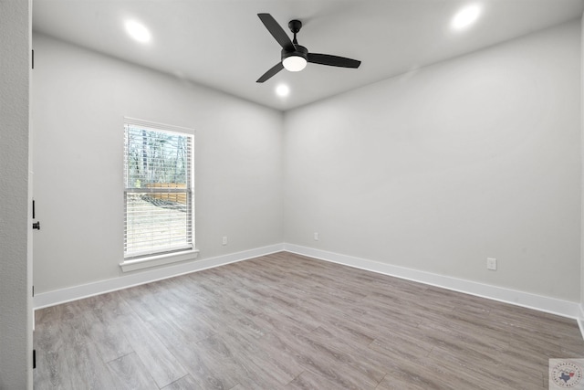 unfurnished room featuring recessed lighting, ceiling fan, baseboards, and wood finished floors