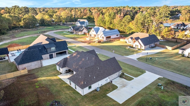 aerial view featuring a residential view and a view of trees