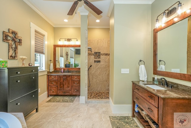 bathroom featuring a tile shower, vanity, crown molding, and ceiling fan