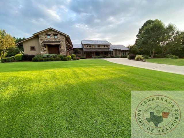 view of front of home with a front lawn