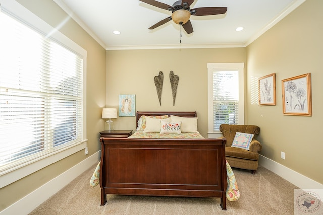 bedroom featuring ceiling fan, light colored carpet, and ornamental molding