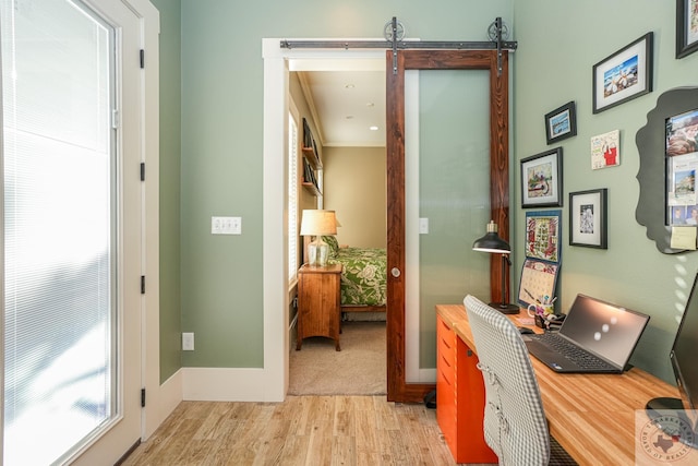 interior space with light hardwood / wood-style flooring and ornamental molding