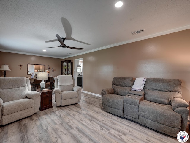 1216 Lavaca Ave, Texarkana, TX 75503 - living area featuring a ceiling fan, light wood-type flooring, ornamental molding, and recessed lighting