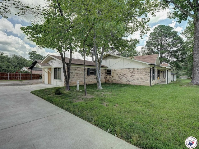 1216 Lavaca Ave, Texarkana, TX 75503 - view of front of home featuring concrete driveway and brick siding