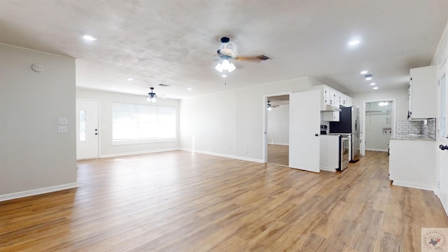 unfurnished living room with light hardwood / wood-style flooring and ceiling fan