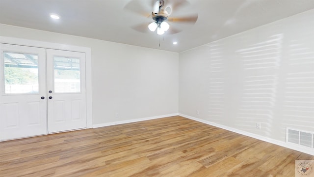 entryway featuring light wood-type flooring, ceiling fan, and french doors