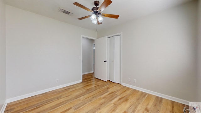 spare room featuring ceiling fan and light hardwood / wood-style flooring