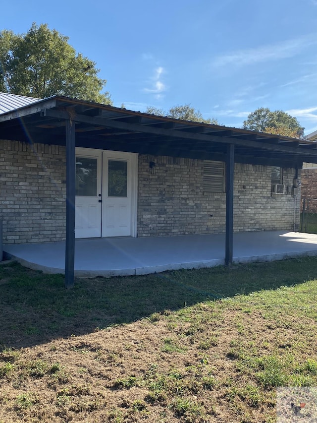 rear view of property featuring a yard and a patio