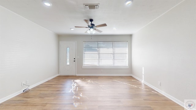 entrance foyer with ceiling fan and light hardwood / wood-style floors