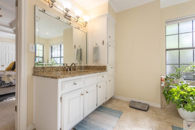 bathroom featuring crown molding and vanity