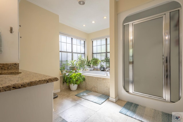 bathroom with vanity, crown molding, tile patterned flooring, and plus walk in shower