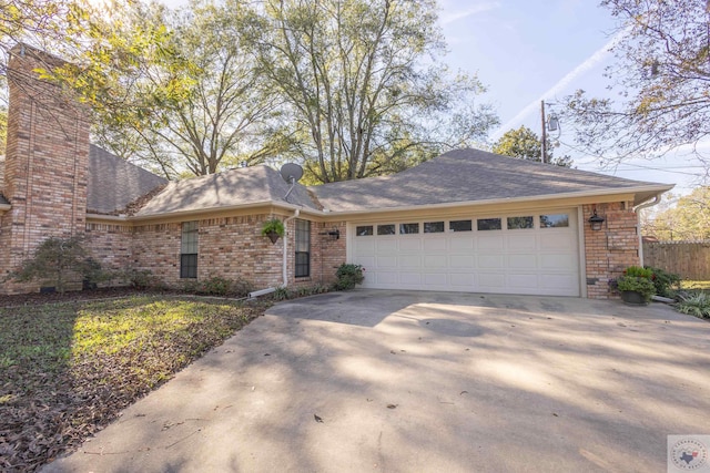 single story home featuring a garage