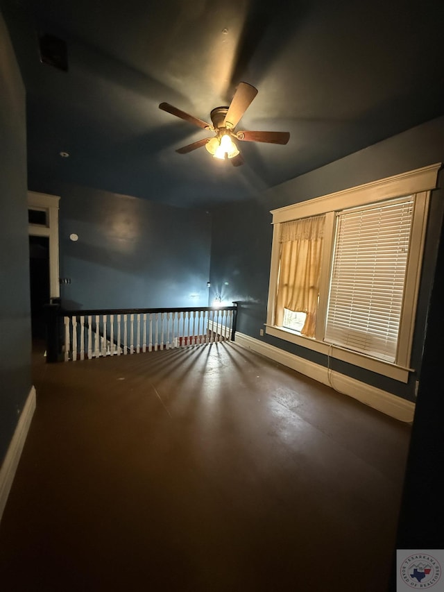 unfurnished room with ceiling fan