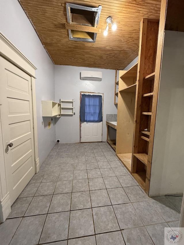 bathroom featuring a wall mounted air conditioner, wood ceiling, and tile patterned flooring