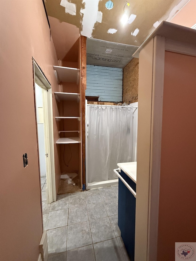 bathroom with tile patterned flooring