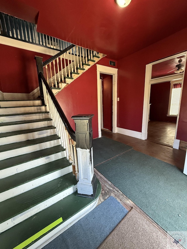staircase with baseboards