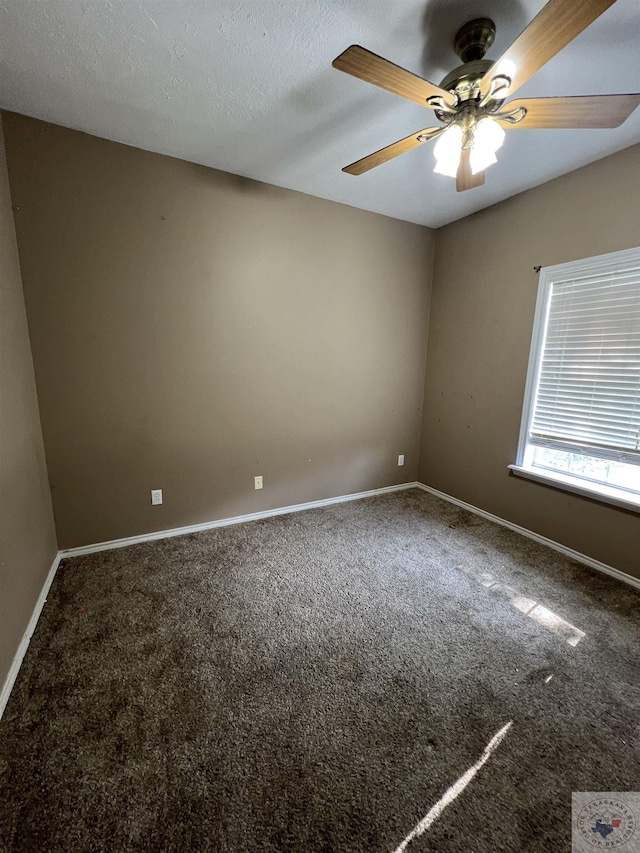 unfurnished room with ceiling fan and carpet flooring