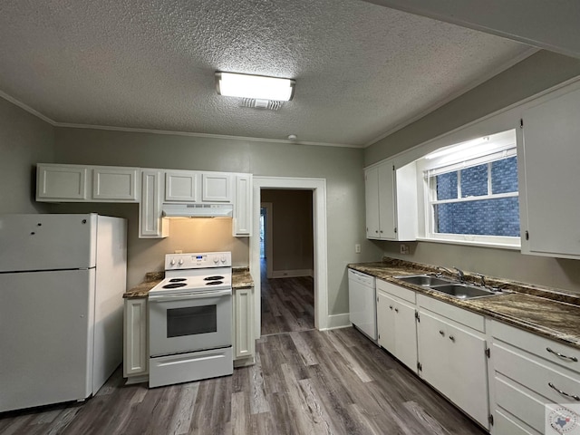 kitchen with sink, white appliances, and white cabinets