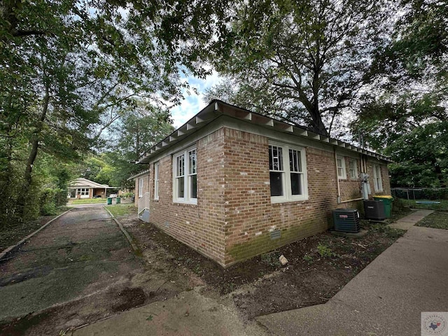 view of side of property featuring central AC unit