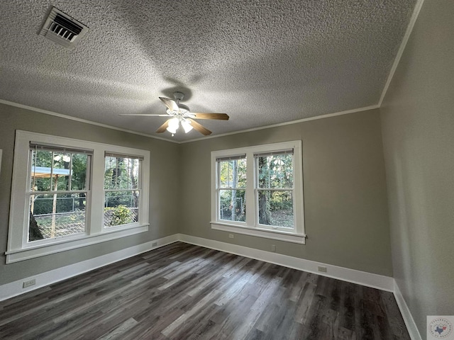 unfurnished room with dark wood-type flooring, a textured ceiling, ceiling fan, and ornamental molding