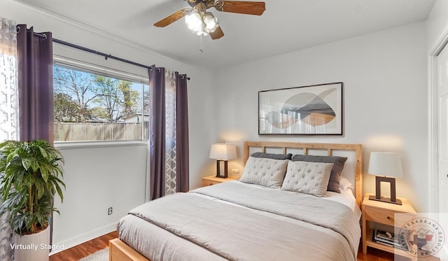1208 Colorado St, Texarkana, TX 75503 - bedroom with wood finished floors and ceiling fan