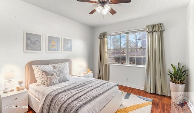 1208 Colorado St, Texarkana, TX 75503 - bedroom with wood finished floors, a textured ceiling, and ceiling fan