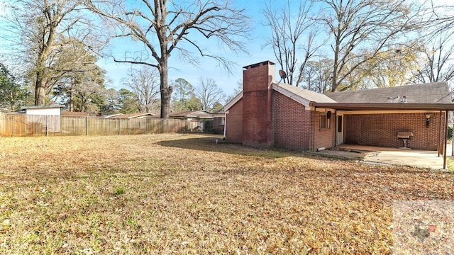 exterior space featuring a patio and a lawn