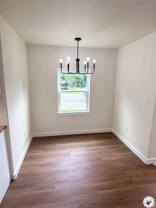 309 N Frost St, New Boston, TX 75570 - unfurnished dining area featuring a chandelier and wood finished floors