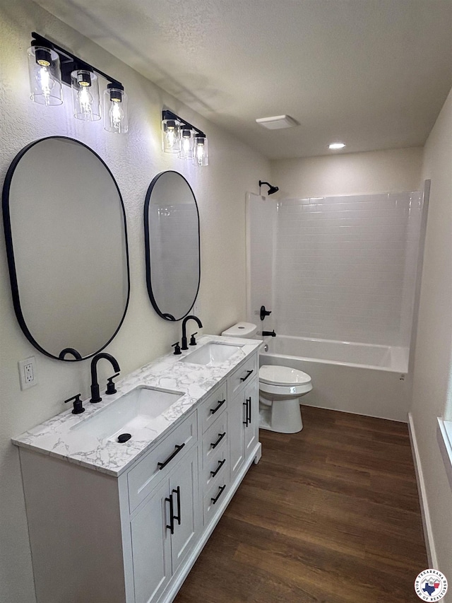309 N Frost St, New Boston, TX 75570 - full bathroom featuring wood finished floors, double vanity, and bathtub / shower combination