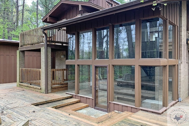 wooden terrace with a sunroom