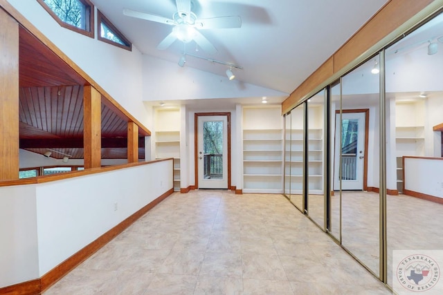 interior space featuring vaulted ceiling, ceiling fan, and a healthy amount of sunlight