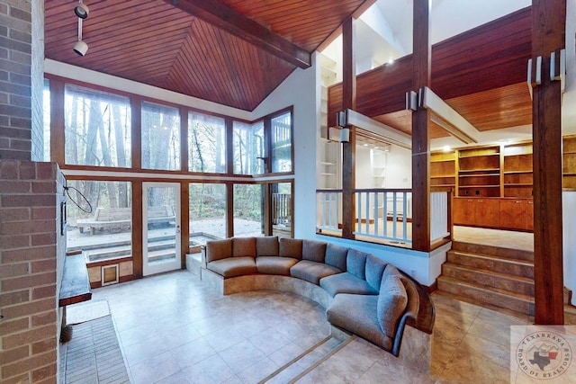 living room with high vaulted ceiling, wooden ceiling, and beamed ceiling