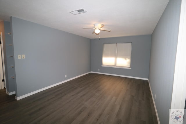 unfurnished room with dark wood-type flooring and ceiling fan