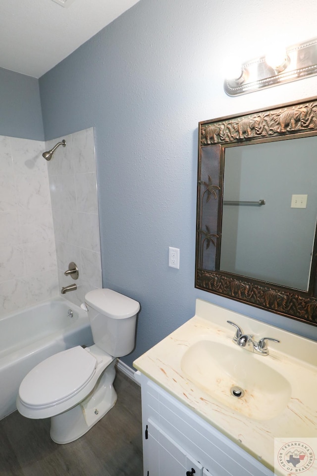 full bathroom featuring bathtub / shower combination, wood-type flooring, toilet, and vanity