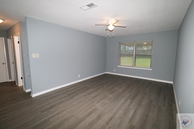 unfurnished room with ceiling fan and dark wood-type flooring