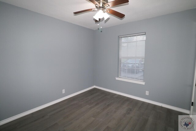 spare room featuring ceiling fan and dark hardwood / wood-style flooring