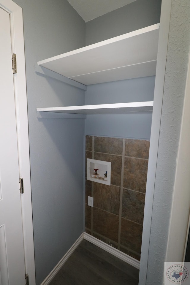 laundry area with washer hookup and dark hardwood / wood-style floors